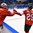 GANGNEUNG, SOUTH KOREA - FEBRUARY 12: Switzerland's Alina Muller #25 high fives teammate Andrea Brandli #31 after a third period goal on Team Japan during preliminary round action at the PyeongChang 2018 Olympic Winter Games. (Photo by Matt Zambonin/HHOF-IIHF Images)

